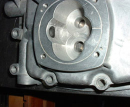 The photo on the left shows the stock pump cavity.